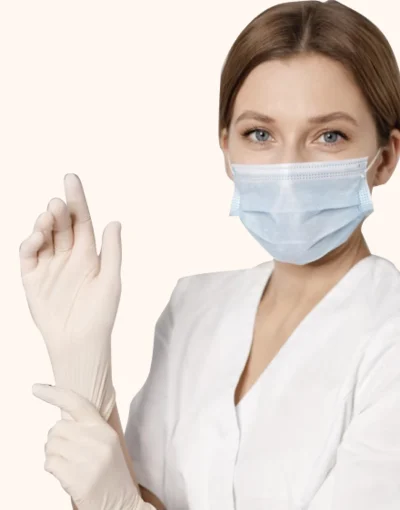 A nurse in a white coat and face mask
